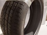 a close up of a tire on a white surface