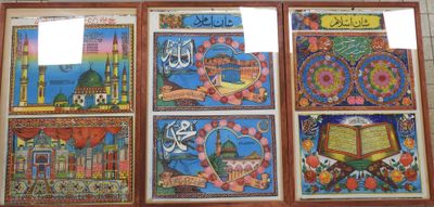 many pictures on the wall of a building with arabic writing on them