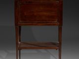 an antique wooden bedside table with a marble top