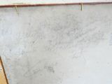 a white board with writing on it sitting on a table