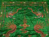 an image of a green table cloth with a dragon design on it