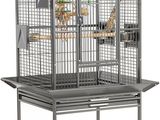 an image of a large bird cage sitting on top of a metal stand