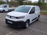 a white van that is parked in a parking lot