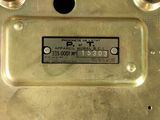 a close up of a metal plate with a label on it
