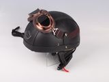 a helmet with goggles attached to it on a white surface
