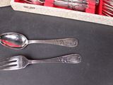 two spoons and a fork in a box