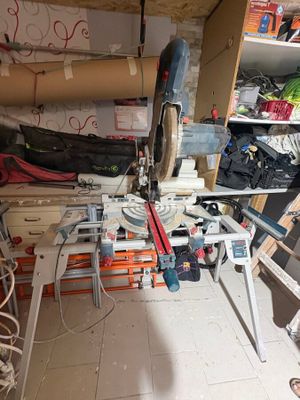 an image of a cluttered room with tools on the shelves