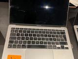 two laptops that are sitting on a table