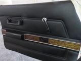 an image of a car door with a wooden handle