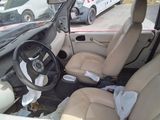 a car that is sitting in a lot with leather seats
