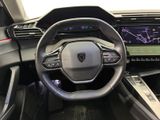 the interior of a car with a steering wheel, dashboard, and display screen