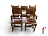 four wooden chairs with brown leather seats and a red and white logo on a white background