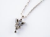 sterling silver giraffe necklace on a chain on a white background