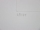 a close up of a piece of paper on a wall