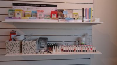 a display of cosmetics products on a shelf in a store