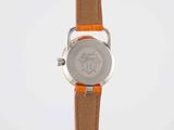 a close up of a wrist watch with an orange strap