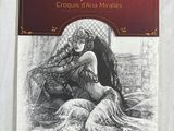 a book with a drawing of a woman sitting on top of a bed