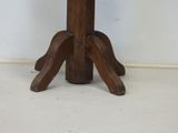 a wooden table with a wooden top and a wooden base