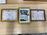 three framed pictures on the wall of a restaurant