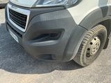 a grey van that is parked in the parking lot