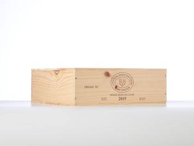 a close up of a wooden box on a table with a white background