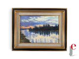 framed oil painting of a lake at sunset with trees in the background
