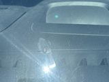 a reflection of a car in the windshield of a car