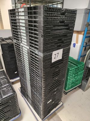many crates stacked on top of each other in a warehouse