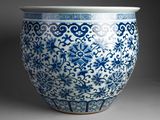 blue and white vase with a design of birds and flowers