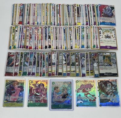 a lot of different pokemon cards on the table