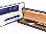 a box with a pen in it and a pen in it