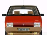 a red car that is parked in front of a white background