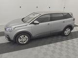 a picture of a silver car parked in a garage