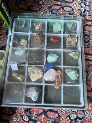 a box with rocks and stones in it on the floor