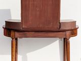 two chairs and a table with a mirror on top of it