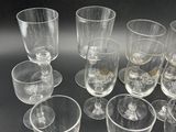 a lot of empty wine glasses sitting on a table