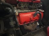 a close up of a red engine on a truck