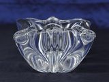 a clear glass bowl with a flower design on it