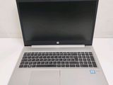 an open laptop computer sitting on top of a white table