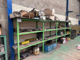 many different types of tools on the shelves in the garage