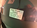 a picture of a helmet with a hair dryer attached to it