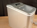 an image of a portable ice maker on a wooden table