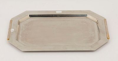 a silver tray with a handle on a white surface
