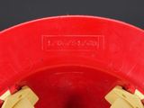 a close up of a red bucket with yellow handles