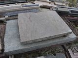 a pile of concrete blocks sitting on the ground