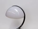 an image of a white lamp with a black base on a white background