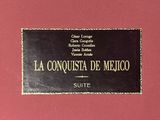 a picture of a sign on a wall that says la conquista de mexico