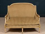 an image of a chair with a striped upholstered seat