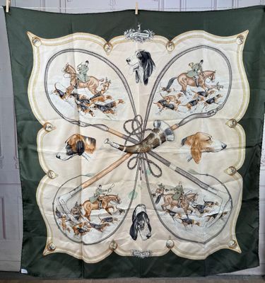 a large green and white scarf with animals on it