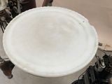 a white plate sitting on top of a table next to an old typewriter